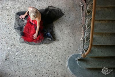 High angle view of women lying down on staircase