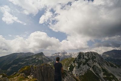 Rear view of man looking at mountains