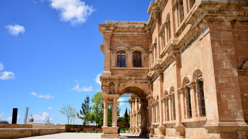 Low angle view of historic building against sky