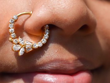 Close-up portrait of girl wearing nose ring