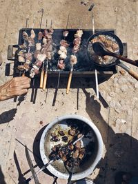 High angle view of meat on skewers