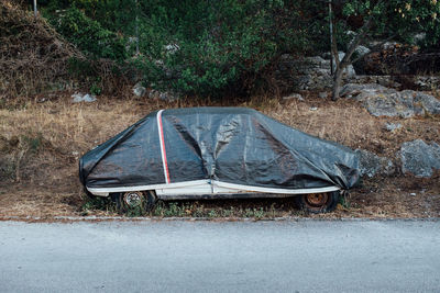 Abandoned car on road