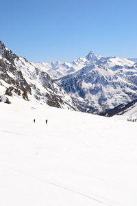 Scenic view of snow covered mountains against sky