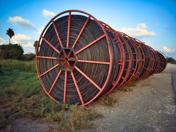 Low angle view of wheel against sky