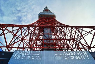 Low angle view of tower against cloudy sky