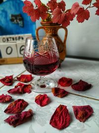 Close-up of red roses in vase on table