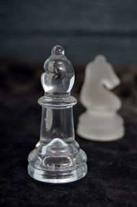 Close-up of chess pieces on table