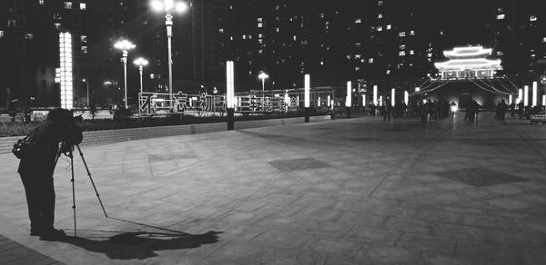 Man in city at night