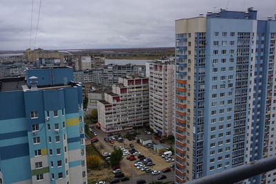 High angle view of buildings in city against sky