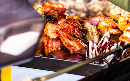 High angle view of meat on barbecue grill