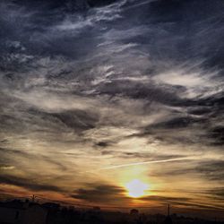 Scenic view of landscape against cloudy sky