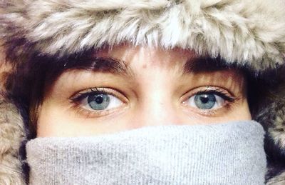 Close-up portrait of man in snow