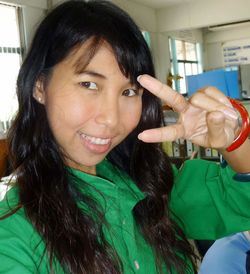 Close-up portrait of smiling young woman