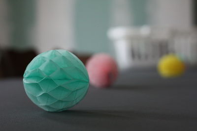 Close-up of paper balls on table