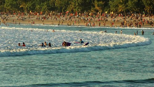 People enjoying in sea
