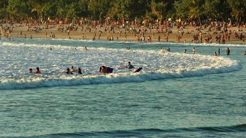 People enjoying in sea