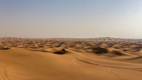 Scenic view of desert against clear sky