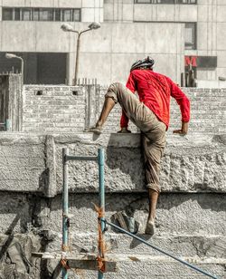 Rear view of man working