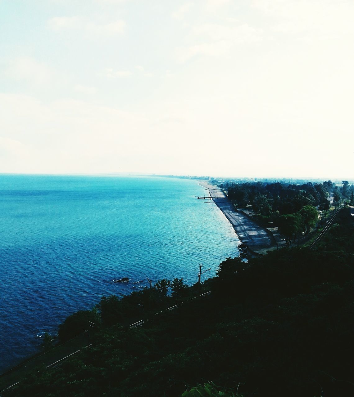 sea, water, nature, horizon over water, scenics, beauty in nature, tranquil scene, tranquility, sky, no people, outdoors, day, travel destinations, nautical vessel