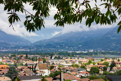 High angle view of townscape and mountains against sky