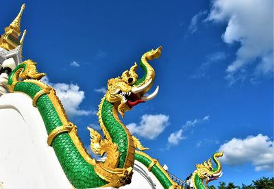 Low angle view of statue against blue sky