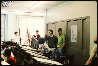 People standing in corridor