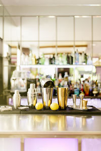 Close-up of cocktail shakers on table