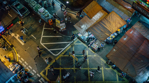 Directly above shot of people walking on street at night