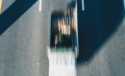 High angle view of car window on road