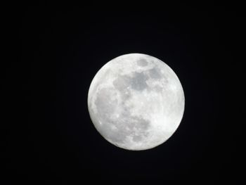 Low angle view of moon against sky at night