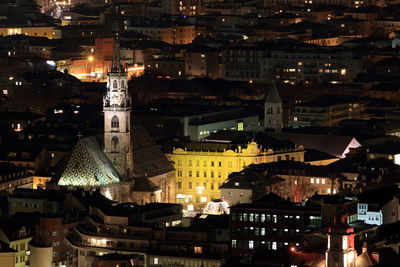 High angle view of illuminated buildings in city at night