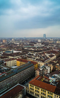 High angle view of buildings in city against sky