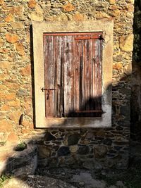 Close-up of window on brick wall