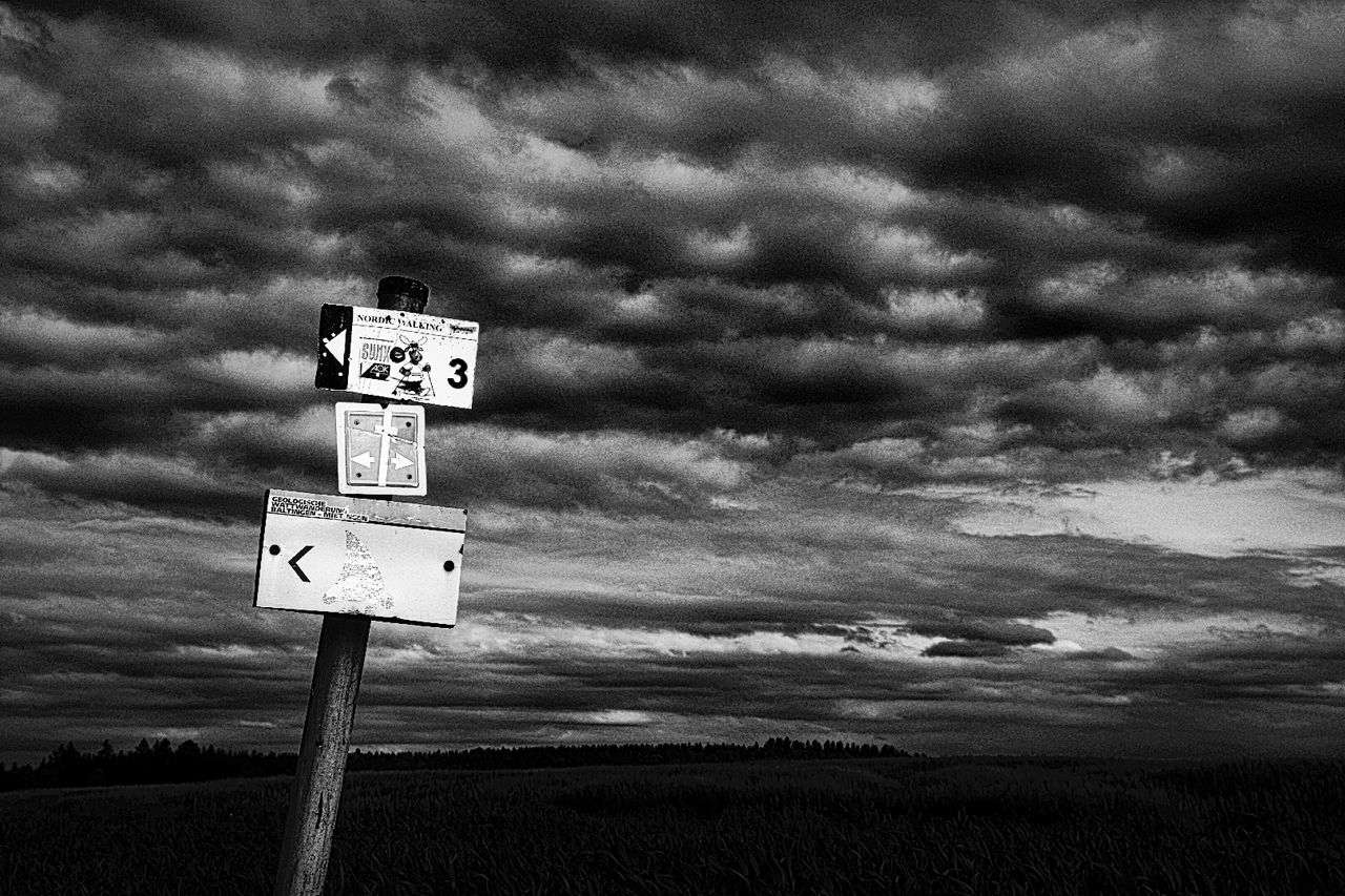 cloud - sky, landscape, cloudy, road sign, cloud, tranquil scene, sky, outdoors, tranquility, day, cloudscape, scenics, non-urban scene, nature, beauty in nature