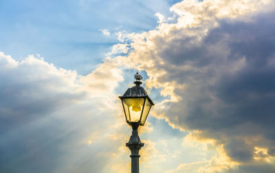 Low angle view of tower against cloudy sky