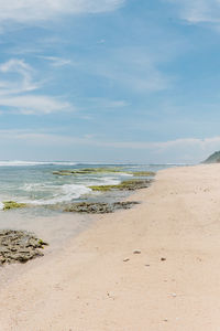 Scenic view of a beach with white sand in uluwatu, indonesia