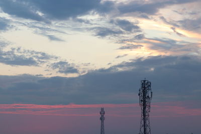 Low angle view of tower against sky during sunset