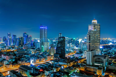 Illuminated buildings in city at night