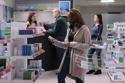 Rear view of woman standing in store