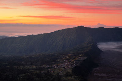 Scenic view of mountains against sky during sunset