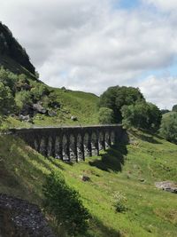 Bridge over landscape against sky
