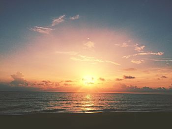 Scenic view of sea against sky at sunset