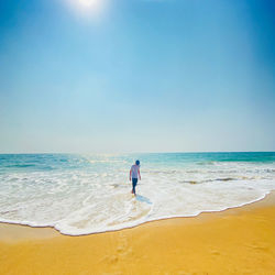 Full length of man on beach against sky