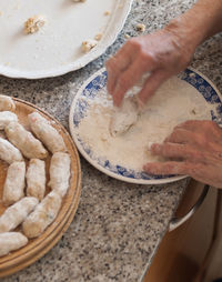 High angle view of person preparing food on table