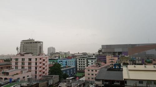 High angle view of buildings in city against sky