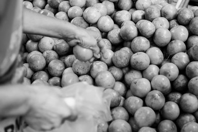 Close-up of hand holding blueberries