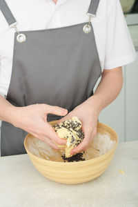 Midsection of woman holding food