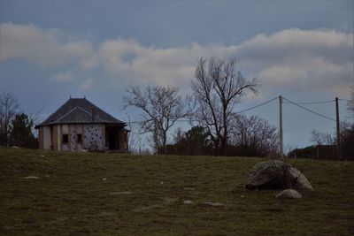 House on field against sky