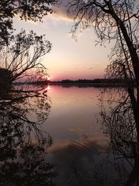 Scenic view of lake against romantic sky at sunset