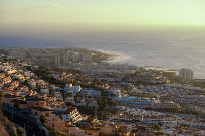 High angle view of city buildings against sky